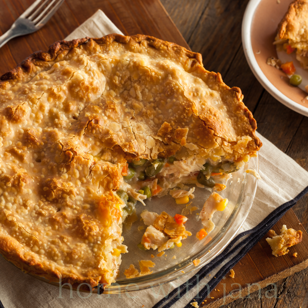 Flaky chicken pot pie on a dinner plate.