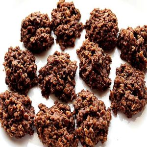 A plate of homemade chocolate peanut butter no-bake cookies with a rich, fudgy texture and visible oats, arranged on a white surface. These classic no-bake cookies are easy to make, require no oven, and have a perfect chewy consistency.