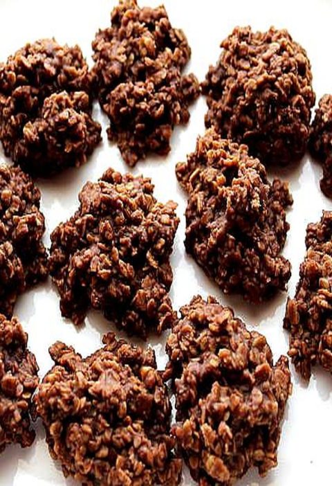 A plate of homemade chocolate peanut butter no-bake cookies with a rich, fudgy texture and visible oats, arranged on a white surface. These classic no-bake cookies are easy to make, require no oven, and have a perfect chewy consistency.