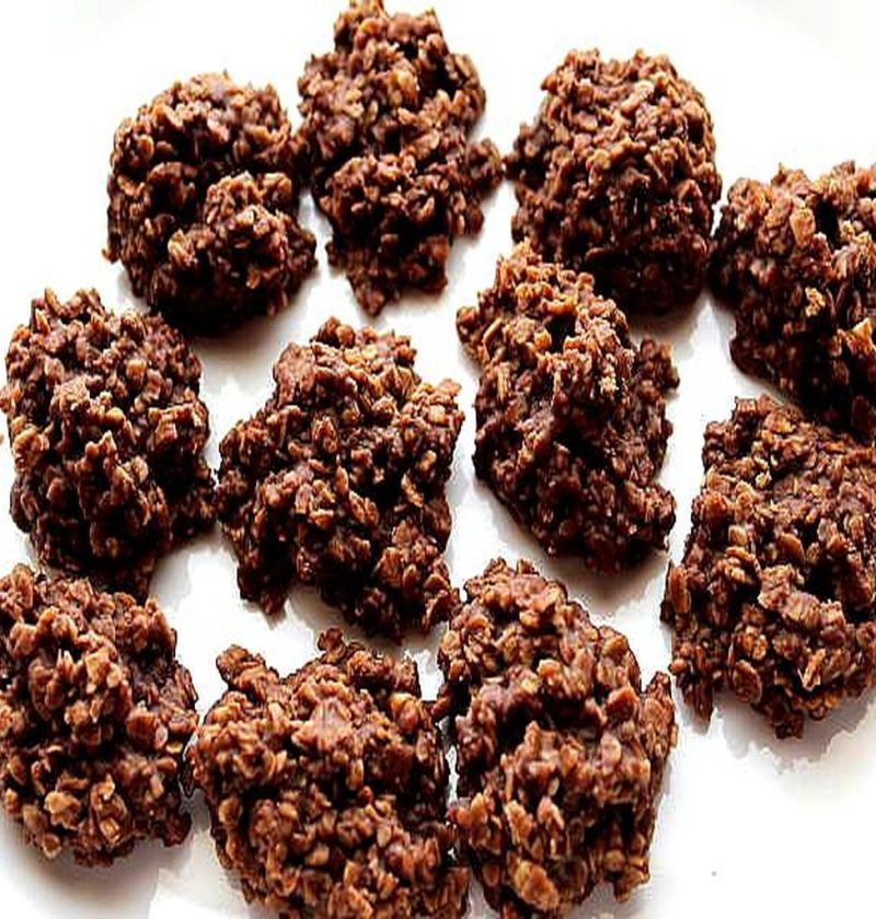 A plate of homemade chocolate peanut butter no-bake cookies with a rich, fudgy texture and visible oats, arranged on a white surface. These classic no-bake cookies are easy to make, require no oven, and have a perfect chewy consistency.