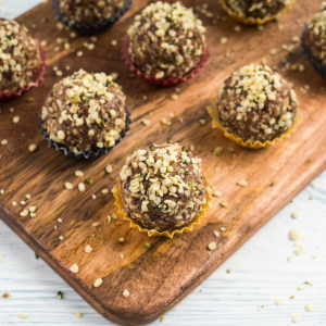No-Bake Peanut Butter Oat Energy Bites on a wooden bread board.