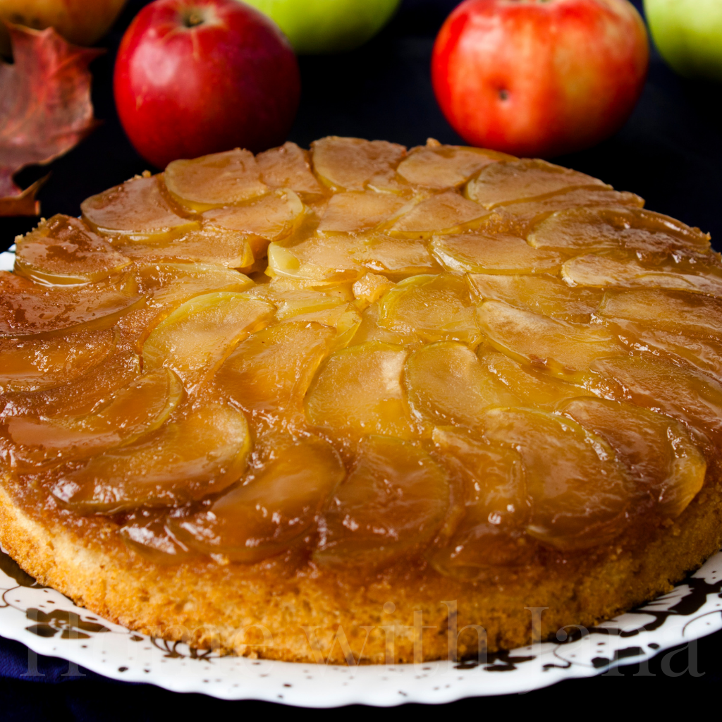 Apple Upside-Down Cake on a white platter.