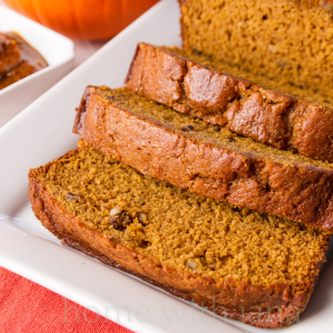 Pumpkin Spice Bread sliced and on a white platter.