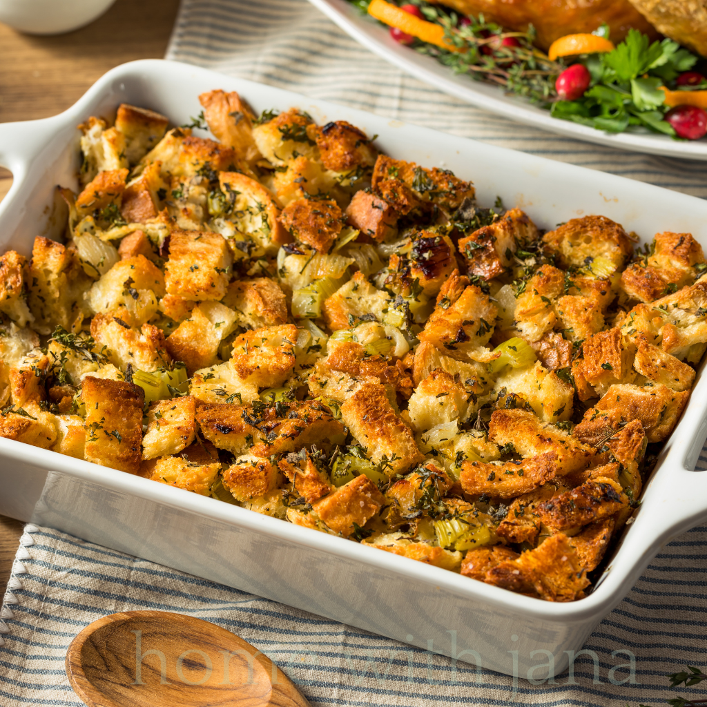 Homemade stuffing in a white serving dish.