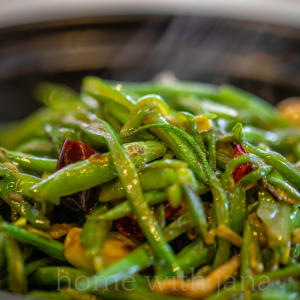 Bright green beans sautéed with garlic and olive oil, served as a simple no-spice side dish.