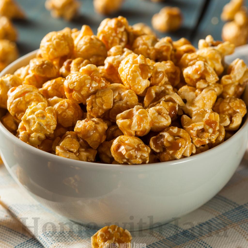 Bowl of homemade caramel popcorn with a buttery golden coating